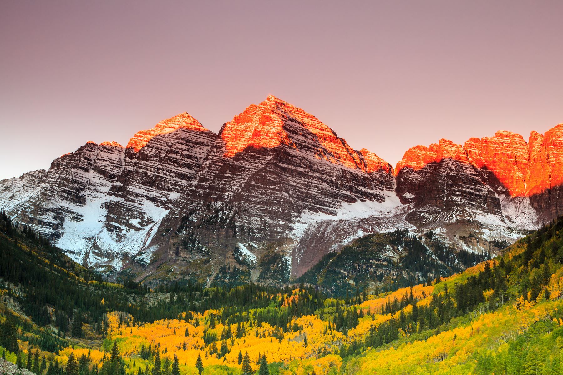 Red colored mountain facing sunset
