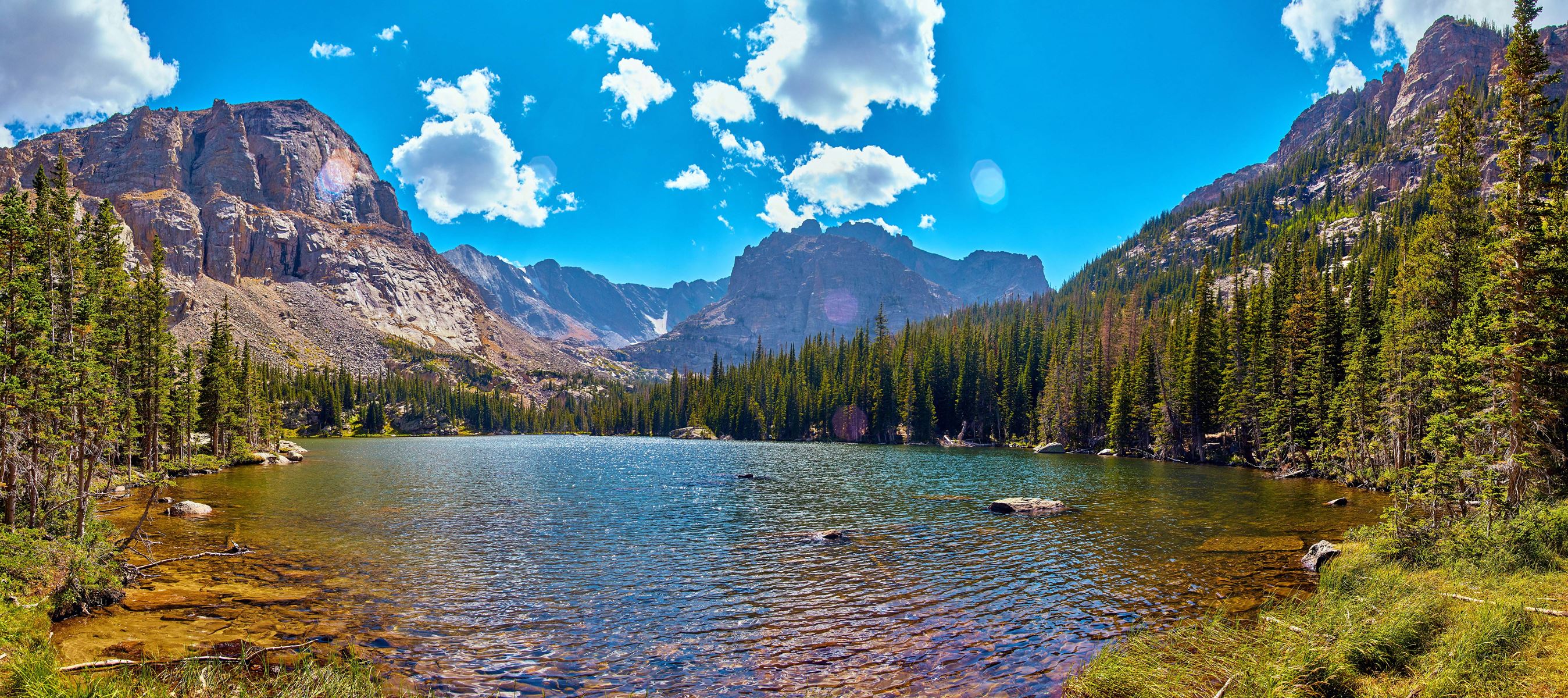 A lake next to mountains