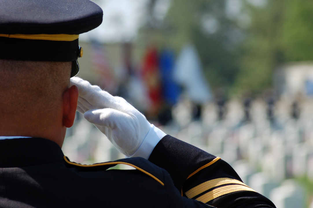 Solider saluting at memorial